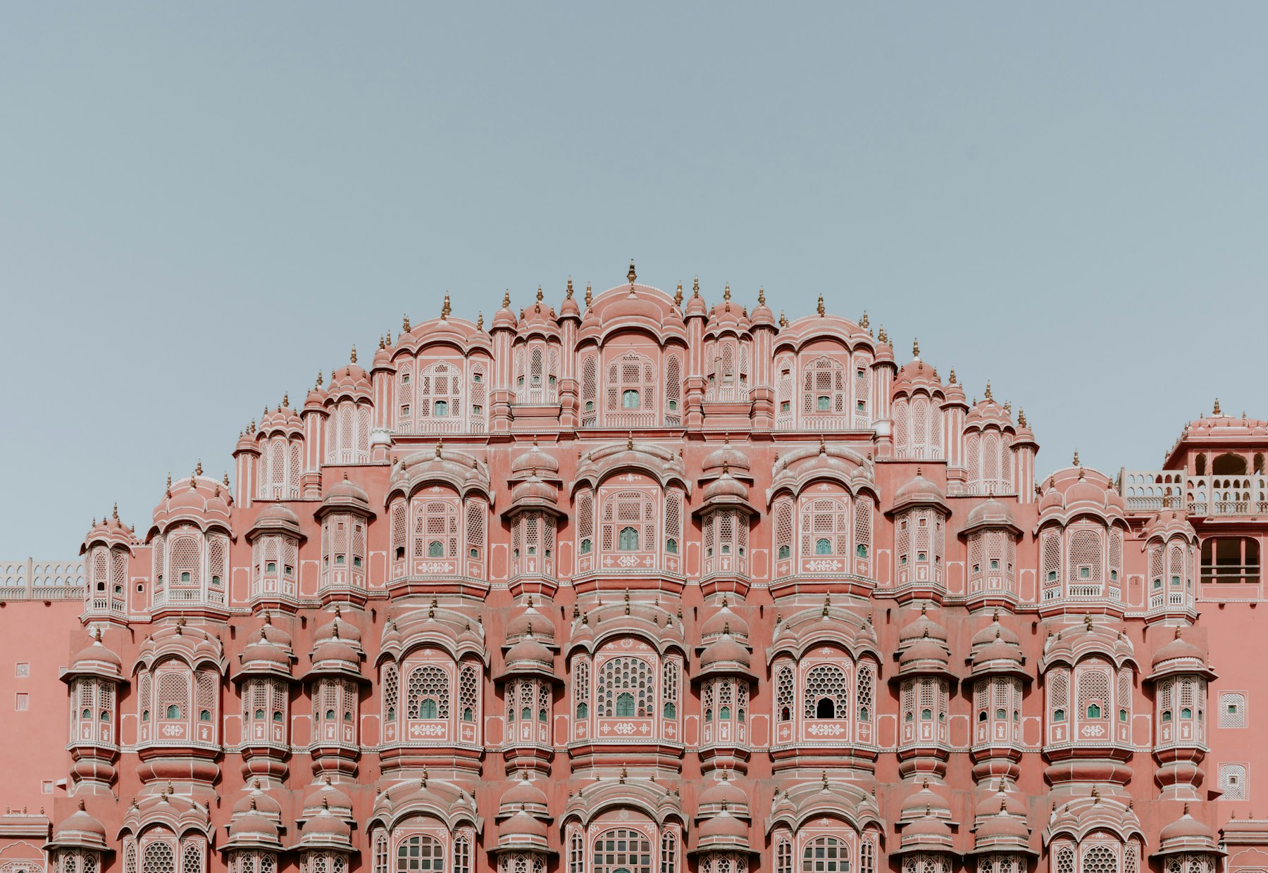 The pink sandstone facade of Hawa Mahal in Jaipur, Rajasthan